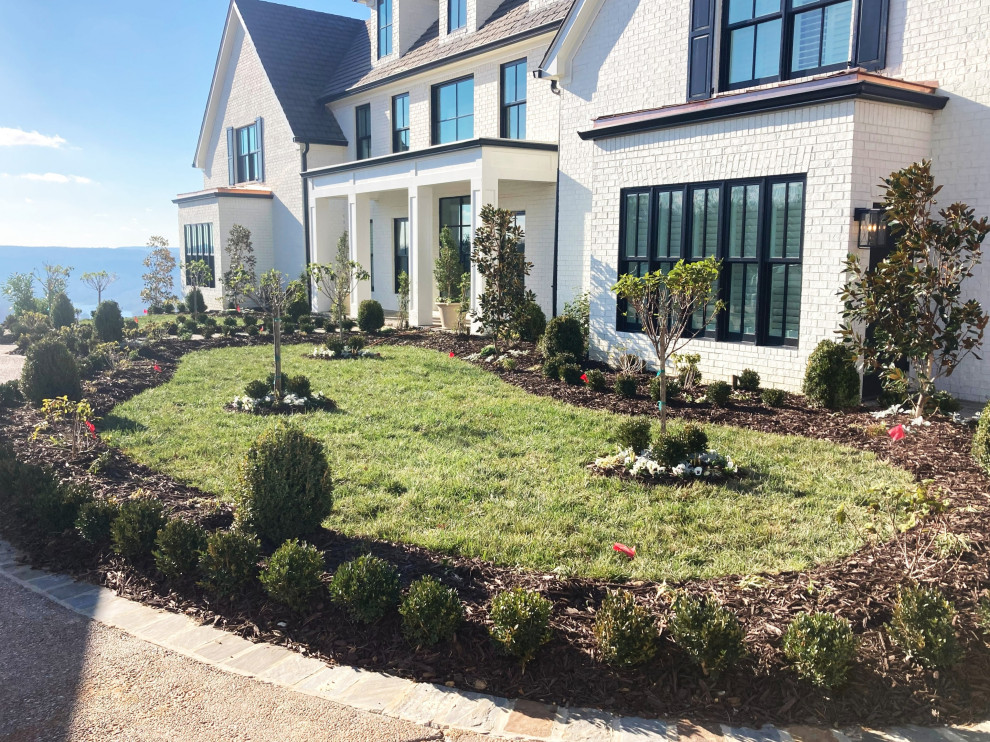 Design ideas for a huge traditional full sun front yard landscaping in Atlanta for winter.