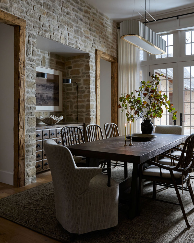 Inspiration for a cottage medium tone wood floor and brown floor dining room remodel in Oklahoma City with white walls