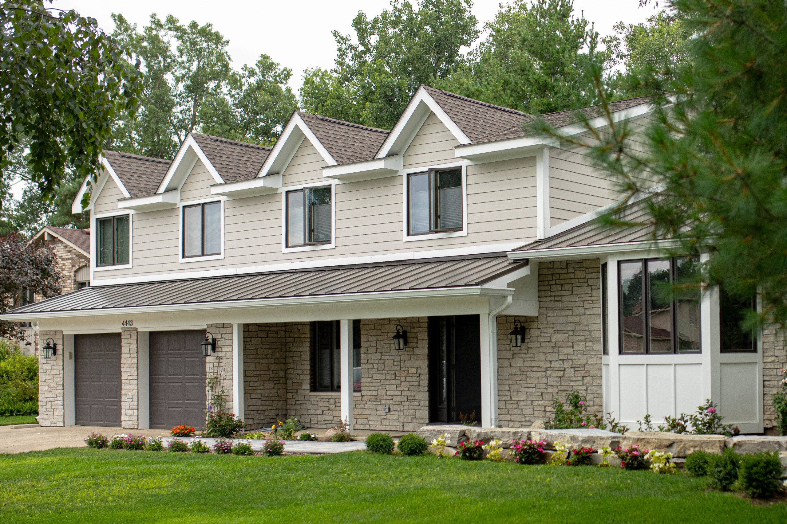 Full Exterior Renovation. New Siding, Stone , Roof , Windows , Landscaping etc.