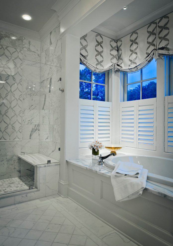This is an example of a large traditional master bathroom in Baltimore with a drop-in tub, a double shower, recessed-panel cabinets, beige cabinets, a two-piece toilet, white tile, marble, blue walls, marble floors, a drop-in sink, laminate benchtops, white floor, a hinged shower door and white benchtops.