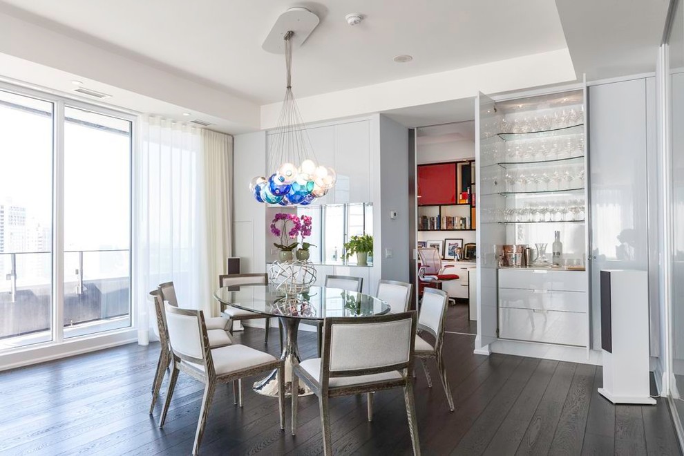 Photo of a contemporary dining room in Toronto with white walls and dark hardwood floors.