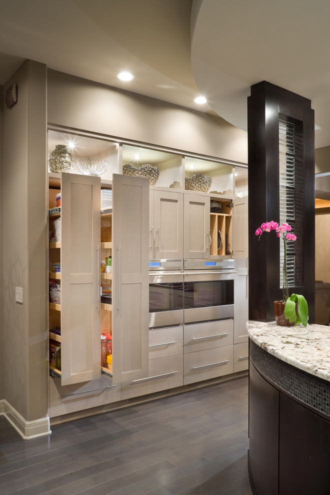 This is an example of a contemporary kitchen in Kansas City with shaker cabinets and beige cabinets.