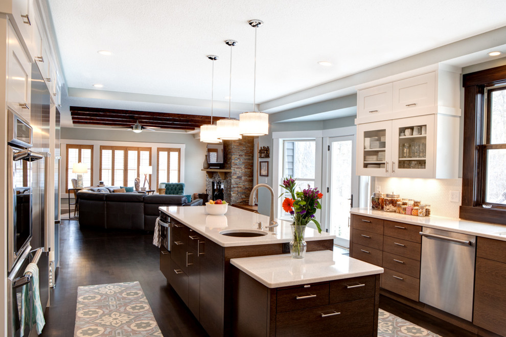 Inspiration for a large transitional u-shaped eat-in kitchen in Minneapolis with an undermount sink, flat-panel cabinets, medium wood cabinets, quartz benchtops, white splashback, ceramic splashback, stainless steel appliances, medium hardwood floors and with island.