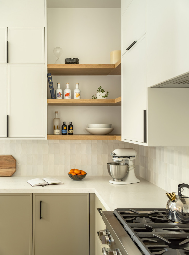 Mid-sized modern l-shaped kitchen pantry in San Francisco with an undermount sink, recessed-panel cabinets, white cabinets, quartz benchtops, grey splashback, ceramic splashback, stainless steel appliances, medium hardwood floors, with island and white benchtop.