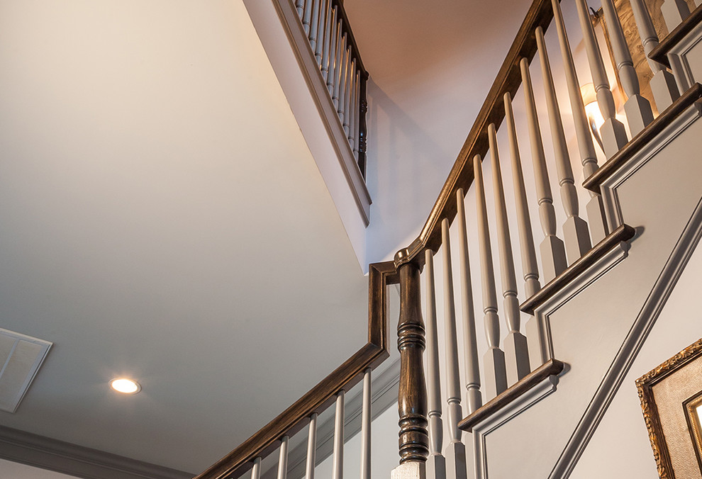 Design ideas for a traditional wood staircase in Houston with wood risers.
