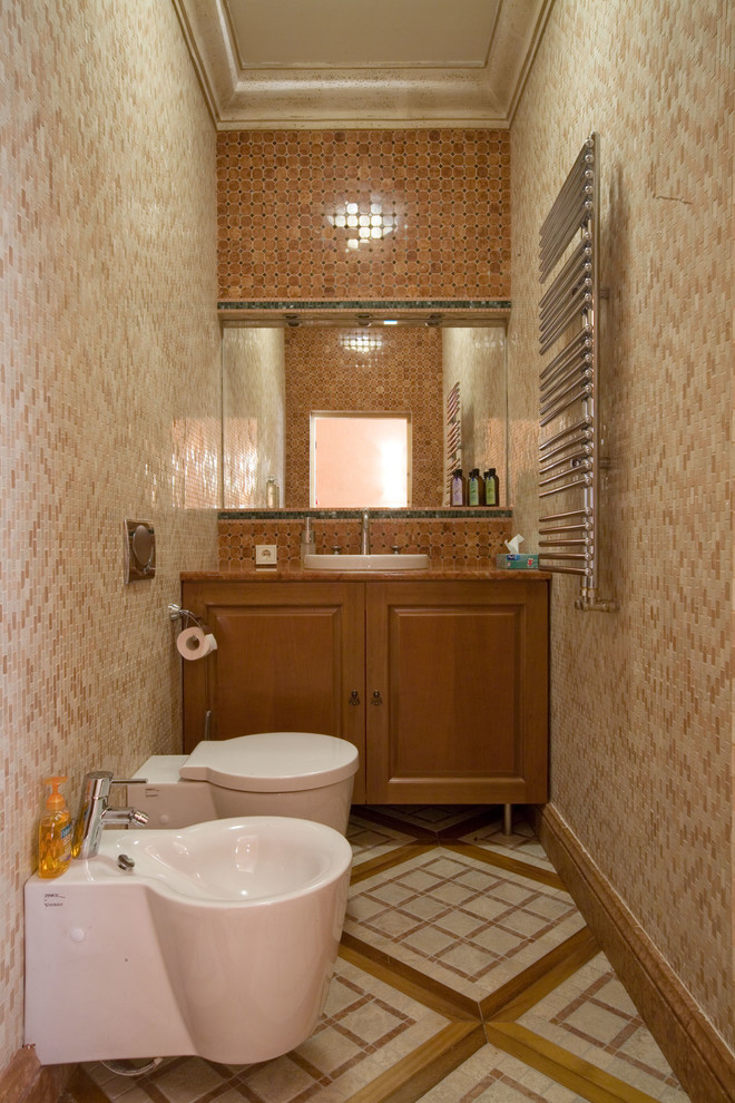 Eclectic powder room in Moscow with a wall-mount toilet, multi-coloured tile, stone tile and marble floors.
