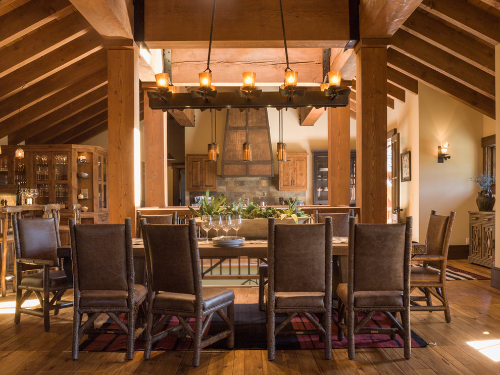 Inspiration for a large country open plan dining in Sacramento with beige walls, medium hardwood floors, no fireplace and brown floor.