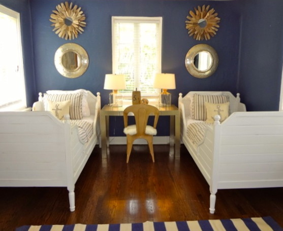 Mid-sized beach style guest dark wood floor bedroom photo in San Francisco with blue walls and no fireplace