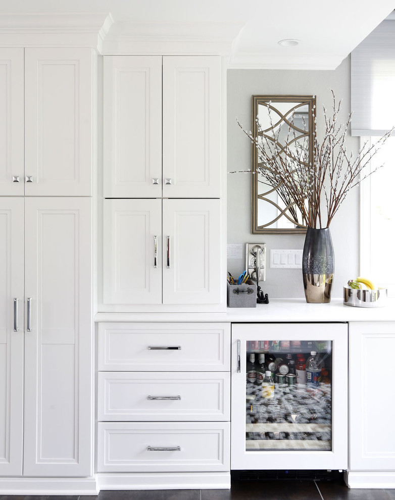 Transitional porcelain tile and gray floor kitchen photo in Cedar Rapids with recessed-panel cabinets, white cabinets and glass countertops