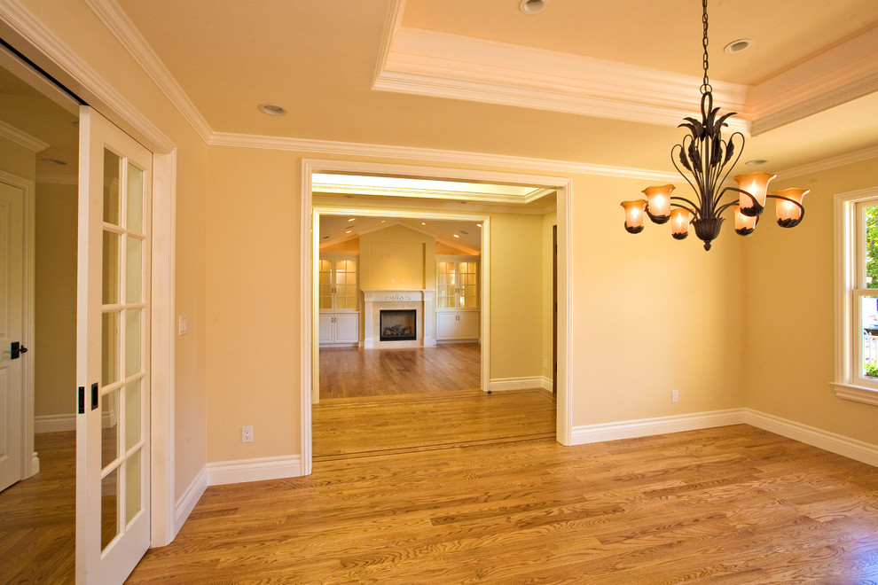 Mid-sized traditional separate dining room in San Francisco with beige walls, medium hardwood floors and no fireplace.