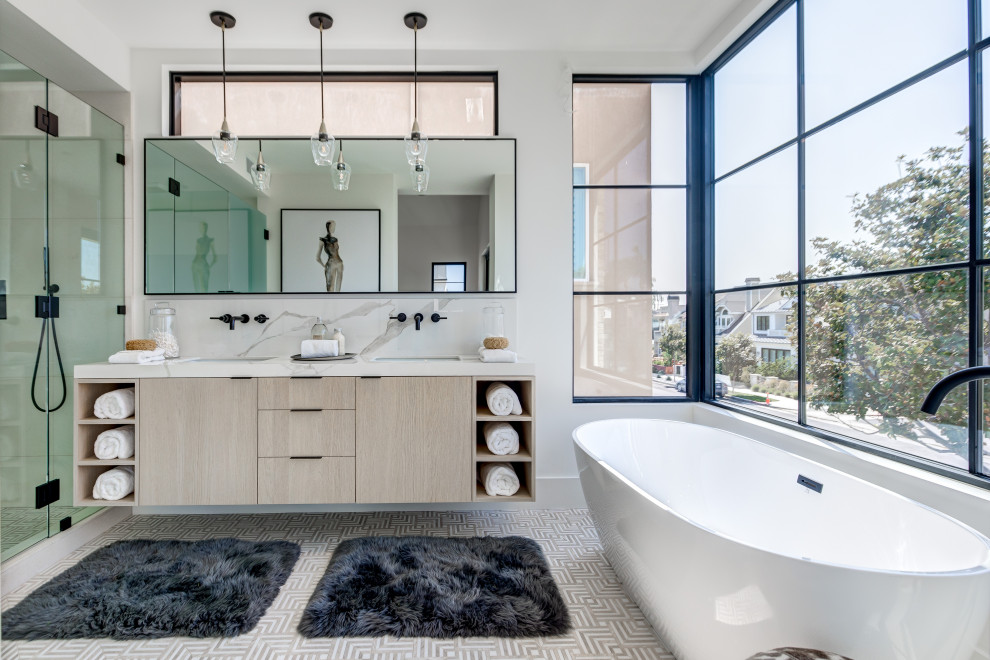 Contemporary master bathroom in Orange County with flat-panel cabinets, light wood cabinets, a freestanding tub, white walls, an undermount sink, grey floor, white benchtops, a double vanity and a floating vanity.