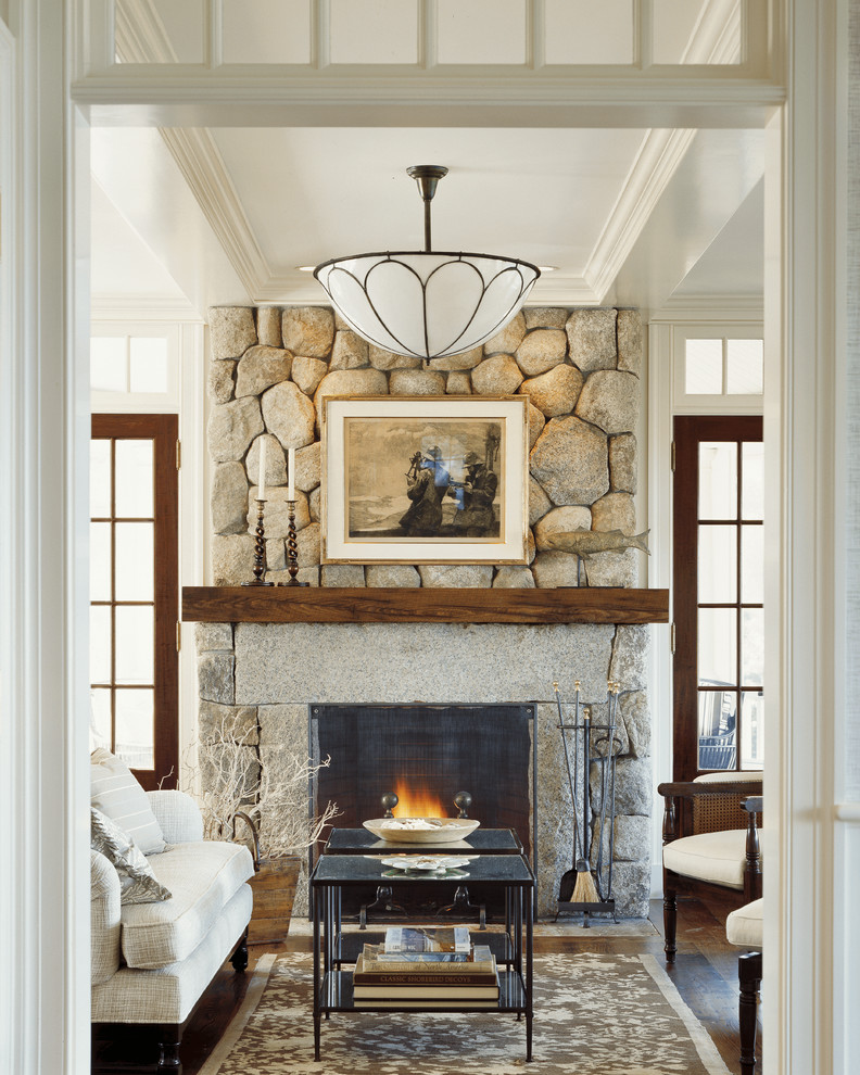 Photo of a mid-sized traditional living room in Boston with a standard fireplace and a stone fireplace surround.