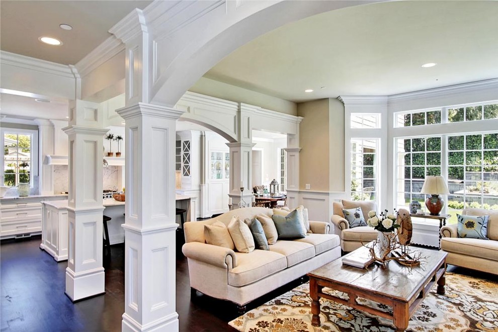 Large traditional open concept family room in Seattle with beige walls, dark hardwood floors, no fireplace and no tv.