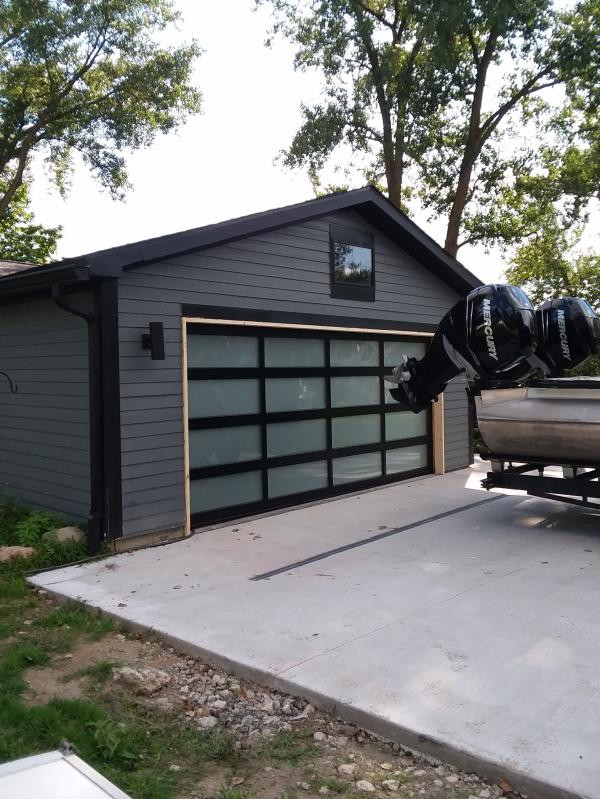 Photo of a modern attached two-car garage in Grand Rapids.