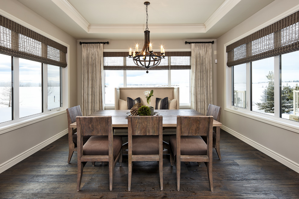 This is an example of a transitional kitchen/dining combo in Calgary with beige walls, dark hardwood floors and no fireplace.