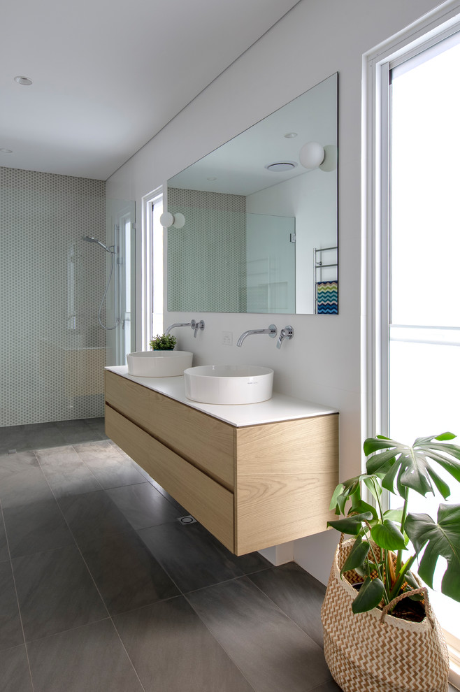 Contemporary master bathroom in Perth with light wood cabinets, a curbless shower, white walls, slate floors, a vessel sink, grey floor, white benchtops, flat-panel cabinets, beige tile and mosaic tile.