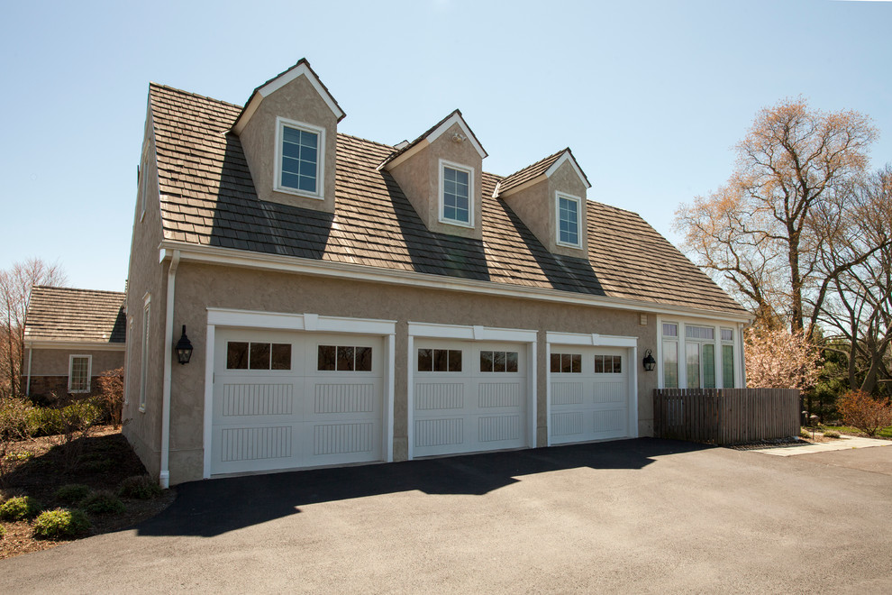 Inspiration for an expansive traditional attached three-car garage in Philadelphia.