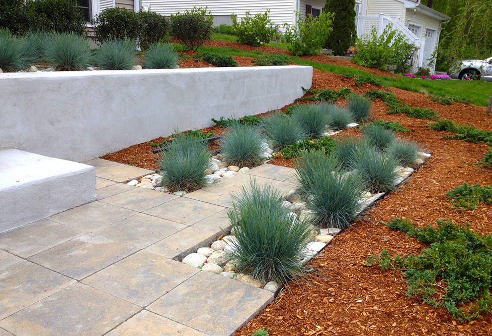 Mid-sized contemporary front yard partial sun garden in Providence with a garden path and concrete pavers for winter.