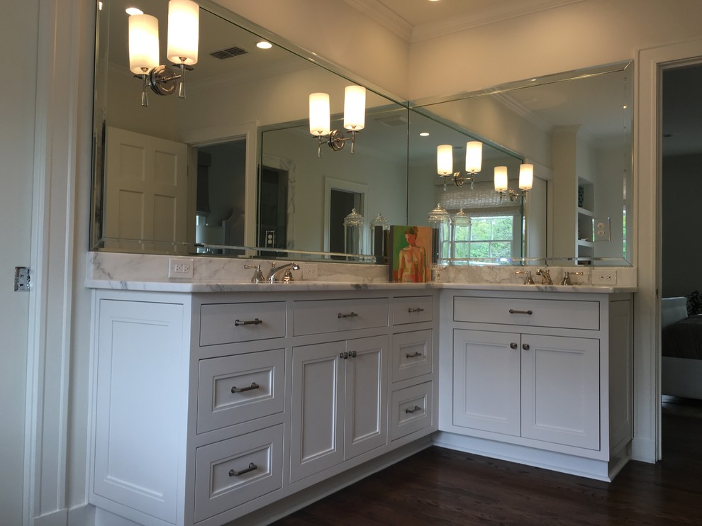 Inspiration for a transitional master bathroom in Austin with recessed-panel cabinets, white cabinets, white walls, dark hardwood floors, an undermount sink, marble benchtops, brown floor and multi-coloured benchtops.