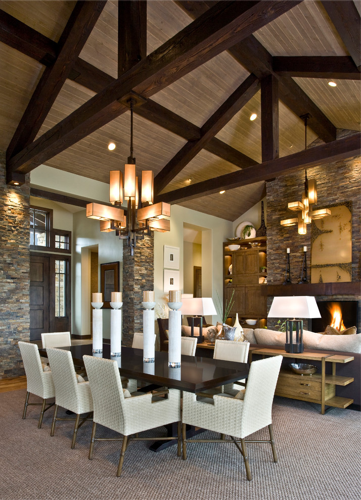 This is an example of a large country open plan dining in Salt Lake City with beige walls and carpet.