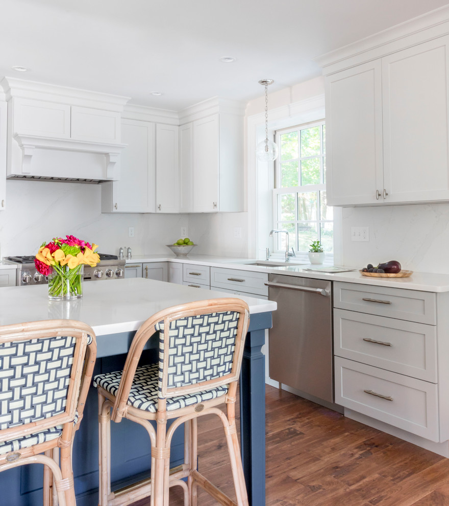 Eat-in kitchen - mid-sized transitional l-shaped light wood floor and brown floor eat-in kitchen idea in Boston with a single-bowl sink, shaker cabinets, blue cabinets, quartzite countertops, white backsplash, stone slab backsplash, stainless steel appliances, an island and white countertops