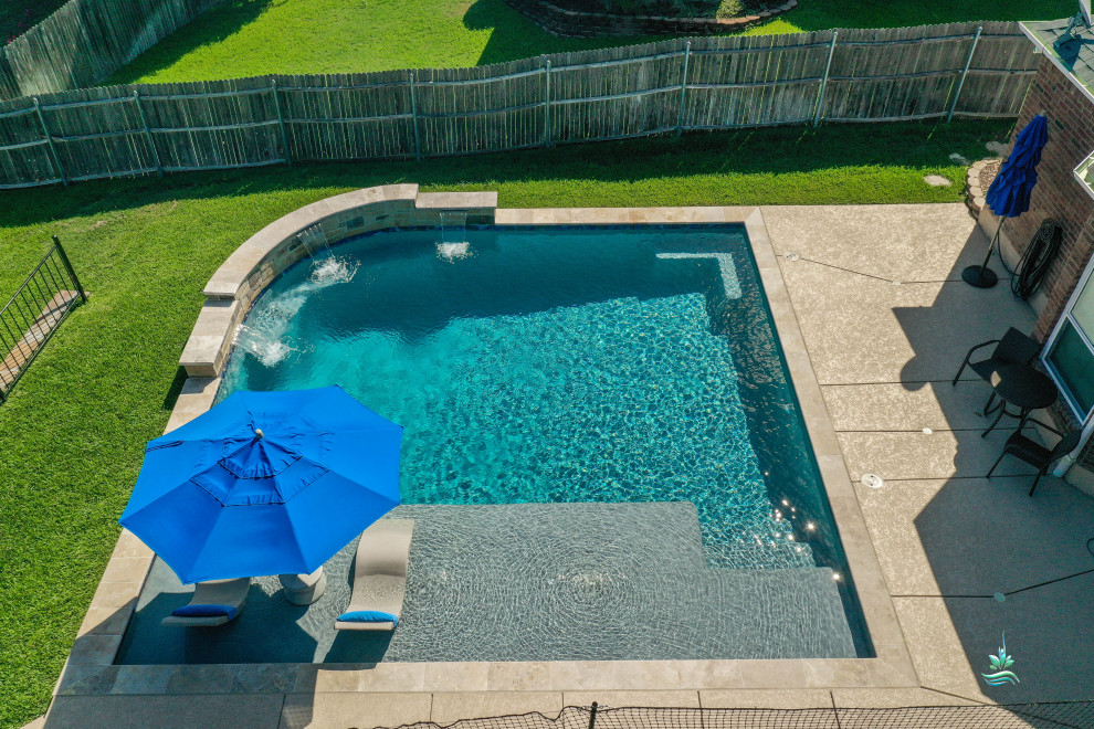 Mid-sized modern backyard custom-shaped natural pool in Dallas with with a pool and decking.