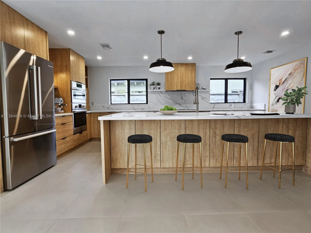Inspiration for a medium sized contemporary kitchen/diner in Miami with a single-bowl sink, flat-panel cabinets, medium wood cabinets, quartz worktops, white splashback, engineered quartz splashback, stainless steel appliances, porcelain flooring, an island, grey floors and white worktops.