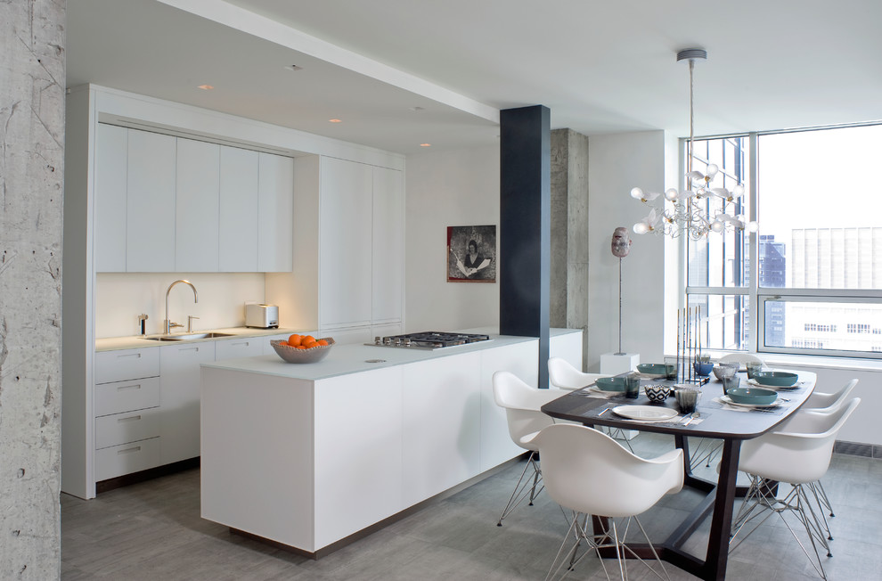 Eat-in kitchen - small contemporary porcelain tile eat-in kitchen idea in New York