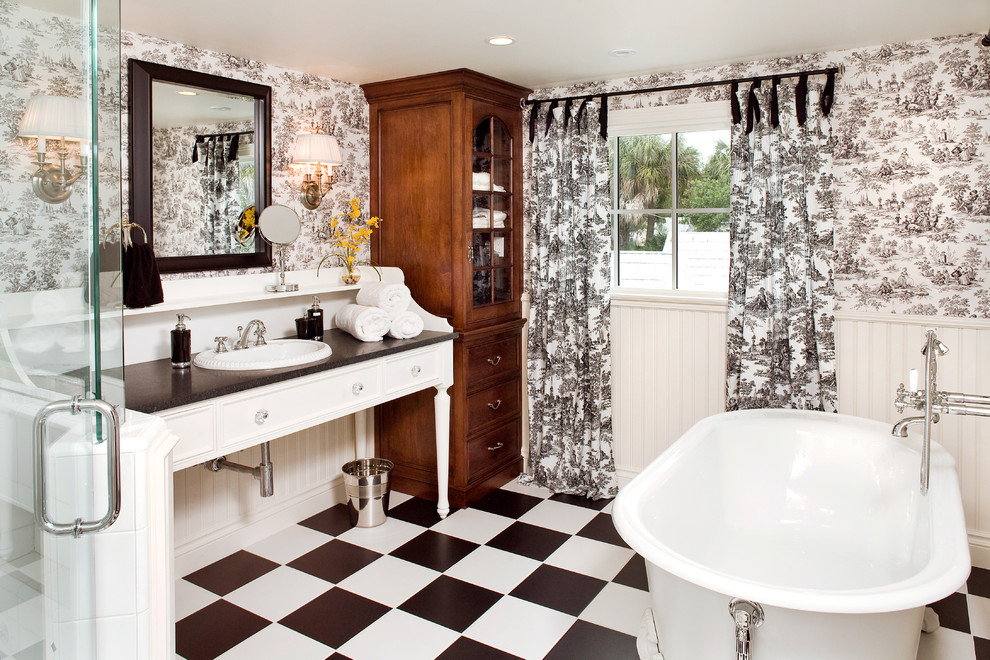 Inspiration for a large timeless master black tile, white tile and ceramic tile ceramic tile bathroom remodel in Tampa with a drop-in sink, white cabinets, multicolored walls and wood countertops