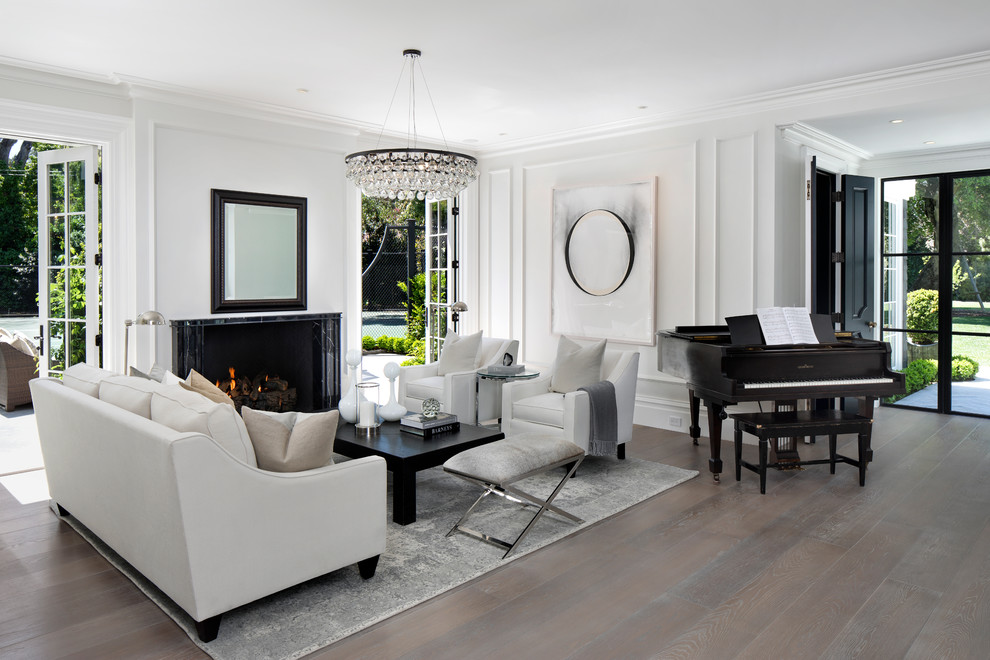 Design ideas for a traditional living room in San Francisco with a music area, white walls, light hardwood floors, a standard fireplace and a stone fireplace surround.