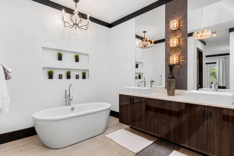Large master bathroom in Orlando with flat-panel cabinets, dark wood cabinets, a freestanding tub, an alcove shower, beige tile, porcelain tile, white walls, porcelain floors, a pedestal sink and engineered quartz benchtops.