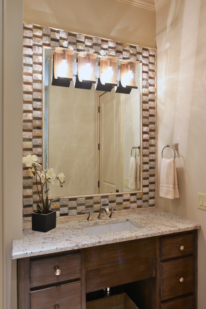 This is an example of a mid-sized transitional 3/4 bathroom in Dallas with an undermount sink, flat-panel cabinets, medium wood cabinets, granite benchtops, an alcove tub, a shower/bathtub combo, a two-piece toilet, beige tile, stone tile, beige walls and travertine floors.