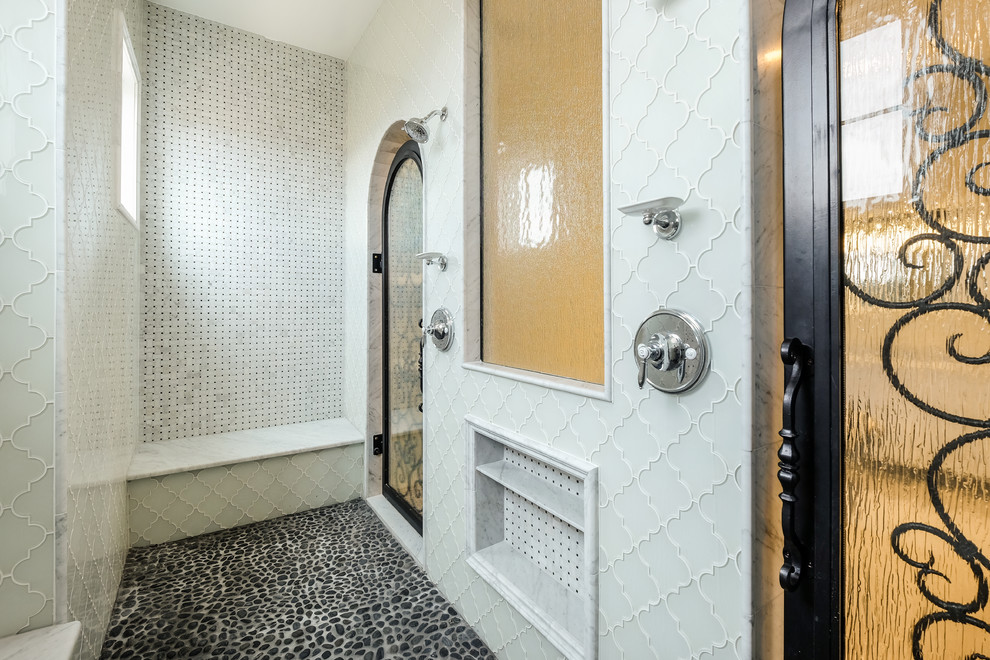 Design ideas for a large transitional master bathroom in Denver with a freestanding tub, an alcove shower, a two-piece toilet, black tile, white tile, beige walls, shaker cabinets, white cabinets, mosaic tile, mosaic tile floors, an undermount sink and marble benchtops.
