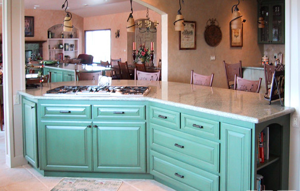 Photo of a mid-sized traditional l-shaped open plan kitchen in San Diego with travertine floors, a double-bowl sink, stainless steel appliances, raised-panel cabinets, turquoise cabinets, granite benchtops, beige splashback, ceramic splashback and with island.