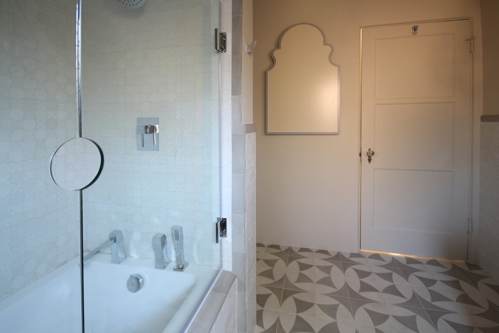 Design ideas for a small mediterranean 3/4 bathroom in San Diego with a vessel sink, furniture-like cabinets, grey cabinets, zinc benchtops, a drop-in tub, a shower/bathtub combo, white tile, ceramic tile, beige walls and ceramic floors.