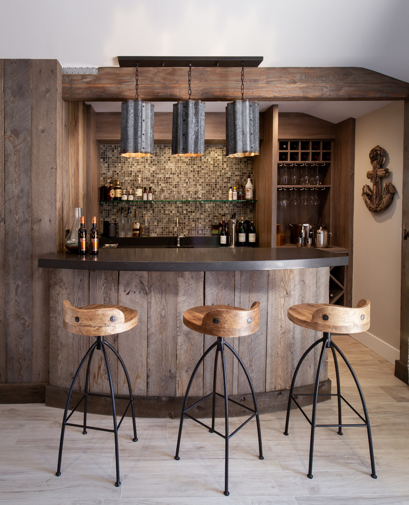Example of a beach style galley wet bar design in Los Angeles with dark wood cabinets and multicolored backsplash