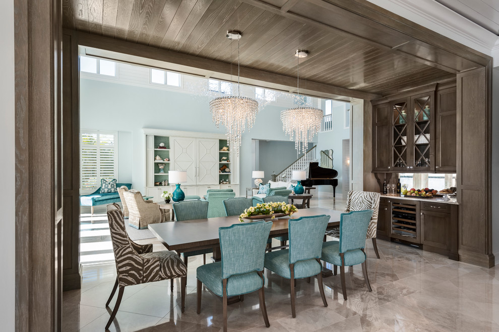 Design ideas for a transitional dining room in Miami with grey floor.