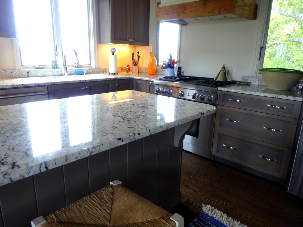 Mid-sized transitional l-shaped dark wood floor eat-in kitchen photo in Charlotte with an undermount sink, shaker cabinets, gray cabinets, granite countertops, white backsplash, stainless steel appliances and an island