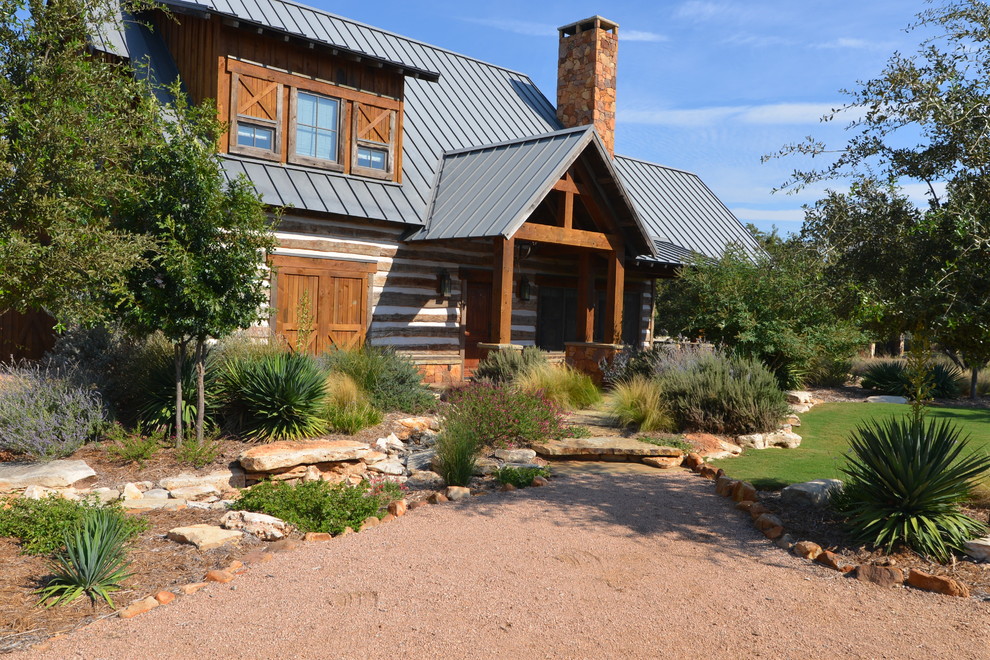 Inspiration for a rustic front yard garden path.