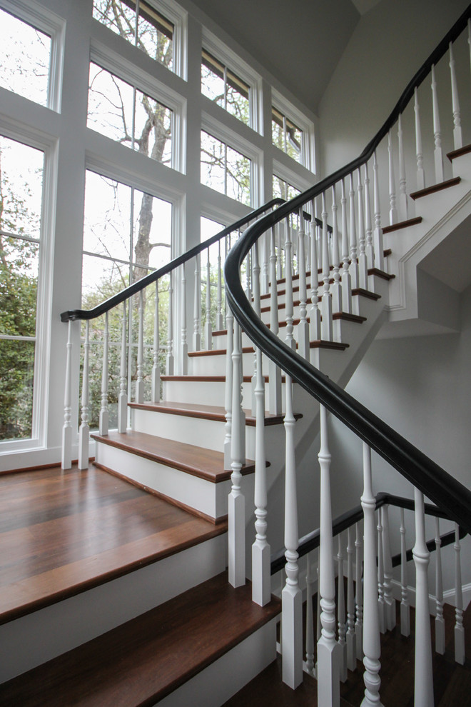 Example of a large transitional wooden floating wood railing staircase design in DC Metro with wooden risers