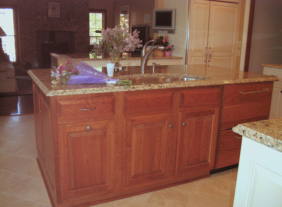 Example of a transitional ceramic tile eat-in kitchen design in Philadelphia with an undermount sink, raised-panel cabinets, granite countertops, multicolored backsplash, ceramic backsplash, stainless steel appliances and an island