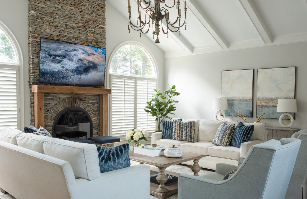 Design ideas for a transitional living room in Charlotte with grey walls, a standard fireplace, exposed beam and vaulted.