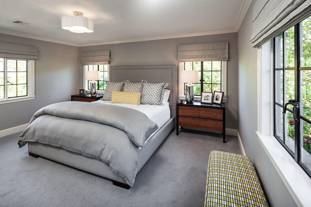 Transitional master bedroom in Portland with carpet.
