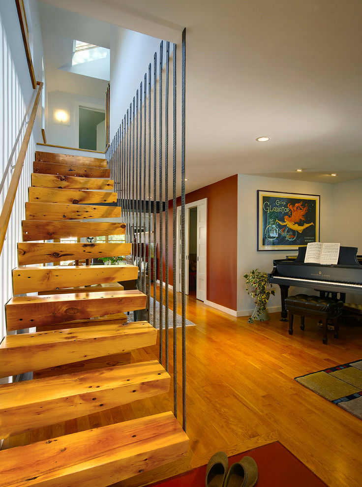This is an example of a contemporary floating staircase in Detroit with open risers.
