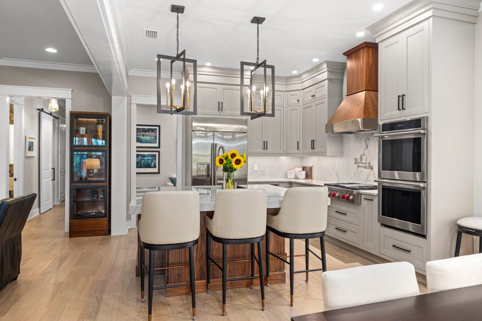 Inspiration for a transitional kitchen remodel with quartzite countertops and stone slab backsplash