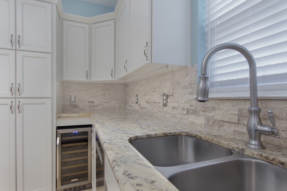 Eat-in kitchen - large transitional galley eat-in kitchen idea in Miami with flat-panel cabinets and white cabinets