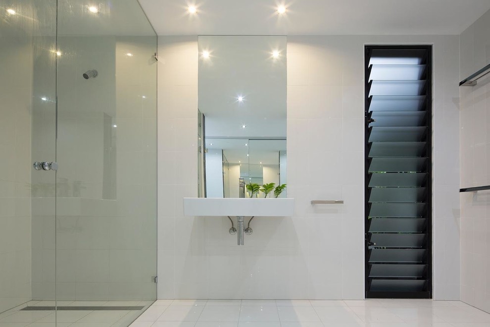 Design ideas for a contemporary bathroom in Brisbane with white tile and white walls.