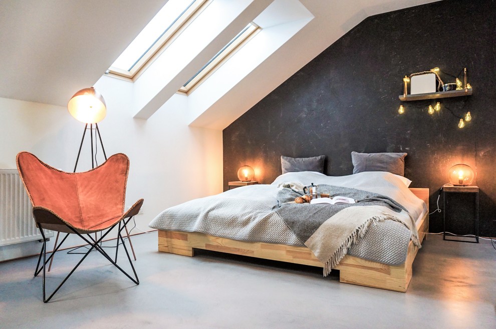 Contemporary bedroom with grey walls and grey floor.