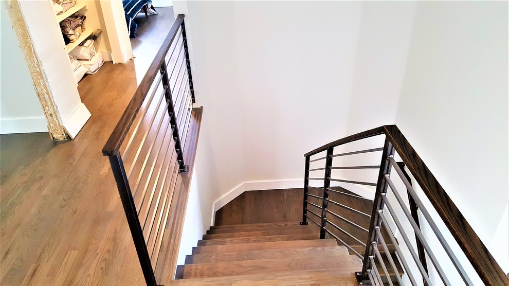 Photo of a mid-sized country wood l-shaped staircase in Denver with wood risers and mixed railing.