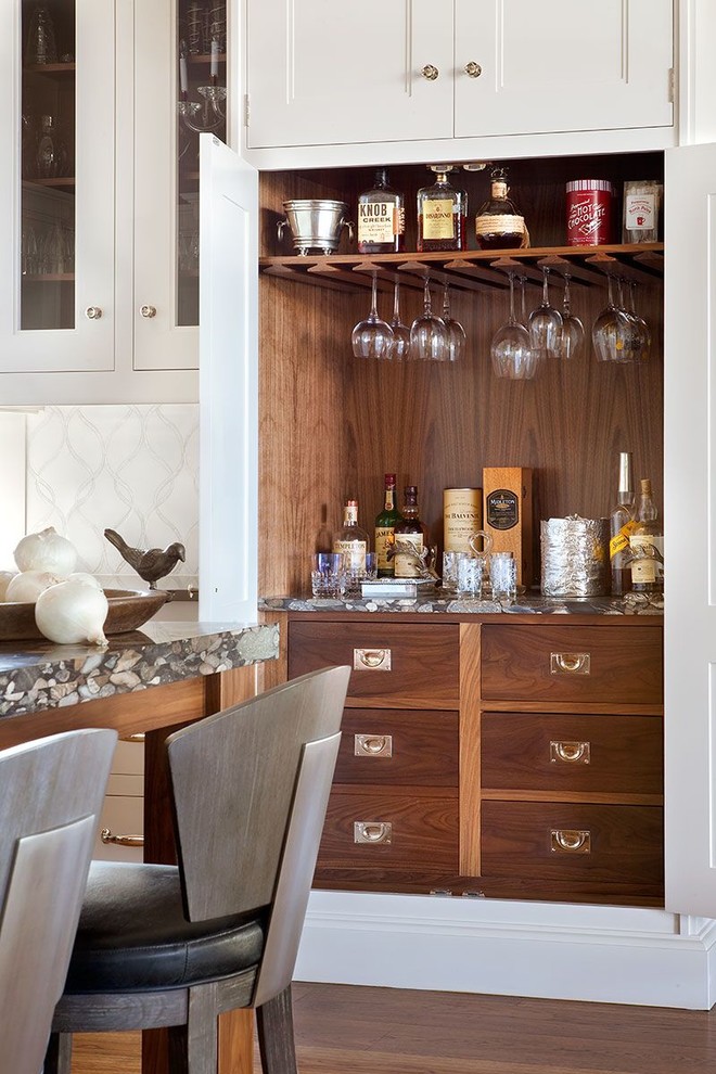 Inspiration for a large transitional u-shaped medium tone wood floor open concept kitchen remodel in Denver with an undermount sink, shaker cabinets, white cabinets, quartz countertops, gray backsplash, stone tile backsplash, stainless steel appliances and an island